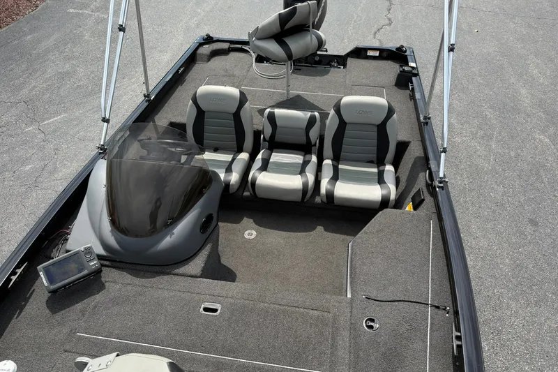 Slide: The Image of 2014 Lowe Stinger 175 boat interior with seating and console. - 19