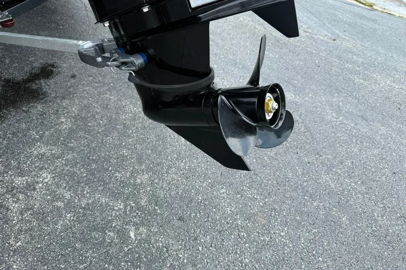 Slide: The Image of Propeller of a 2014 Lowe Stinger 175 boat on pavement background. - 4