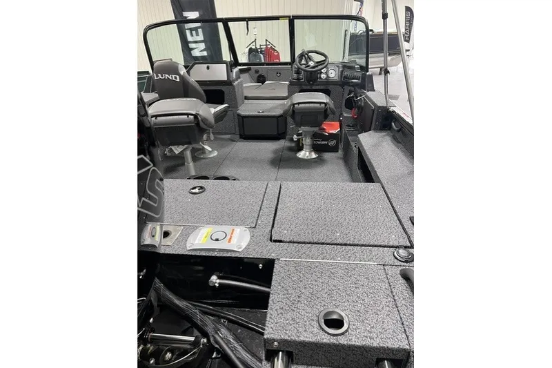 Slide: The Image of 2027 Lund 1875 Impact XS boat interior with seating and steering console. - 4