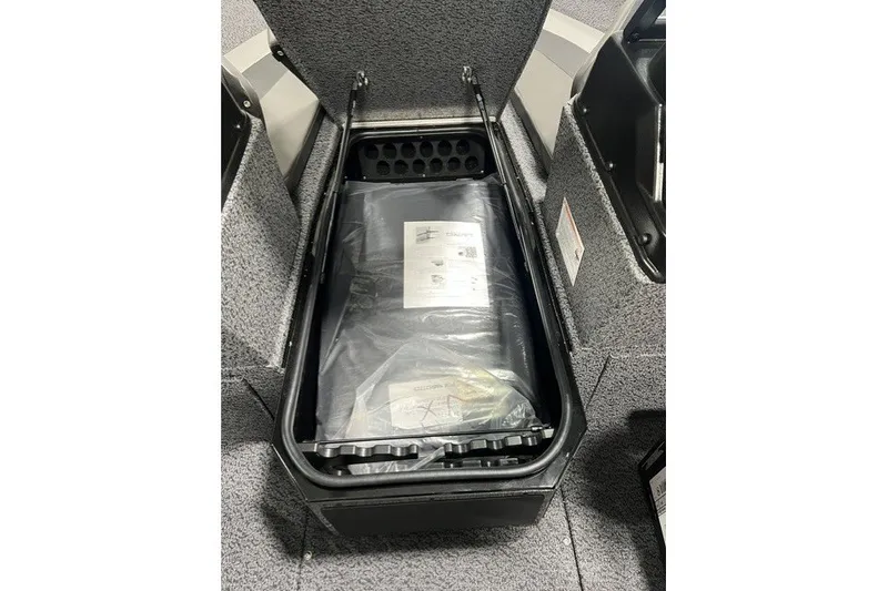 Slide: The Image of Storage compartment in 2027 Lund 1875 Impact XS boat, featuring organized interior space. - 11