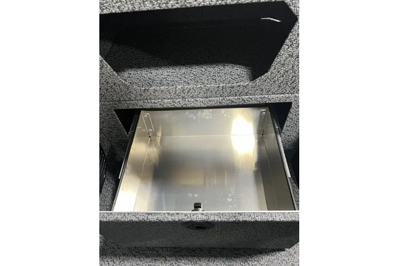Slide: The Image of Storage compartment in 2027 Lund 1875 Impact XS boat, featuring a metallic interior. - 15