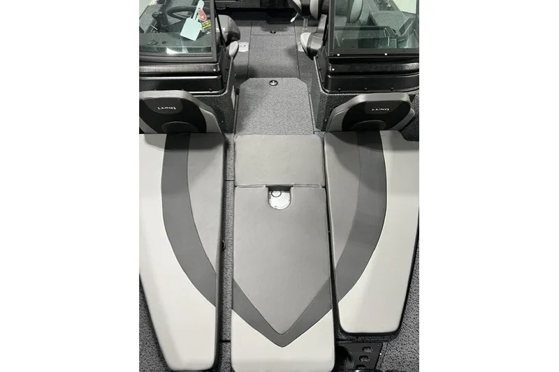 Slide: The Image of Interior view of 2027 Lund 1875 Impact XS boat, featuring sleek seating and storage. - 8