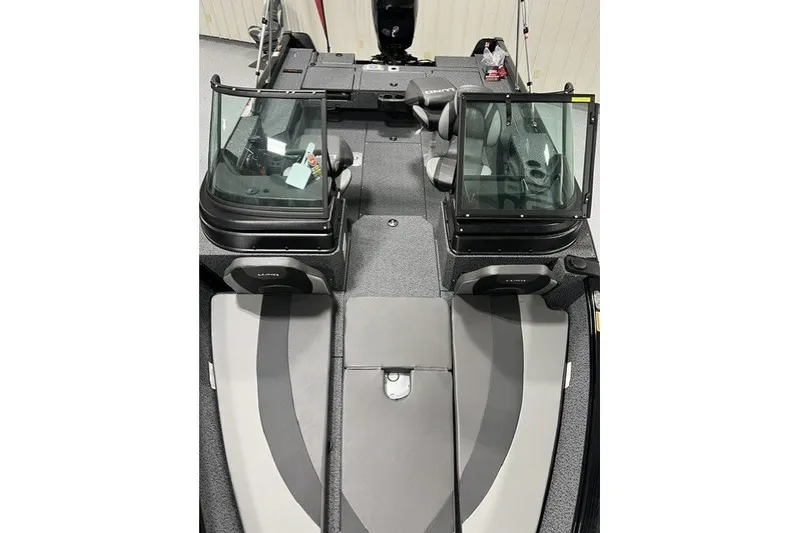Slide: The Image of 2027 Lund 1875 Impact XS boat interior with dual consoles and seating. - 7