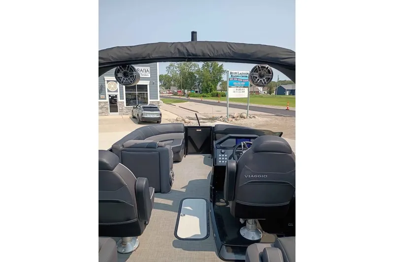 Slide: The Image of 2024 Viaggio Diamante U 22 boat interior with steering console and seating. - 7