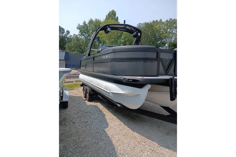The Image of 2024 Viaggio Diamante U 22 pontoon boat on trailer, parked outdoors. - 0