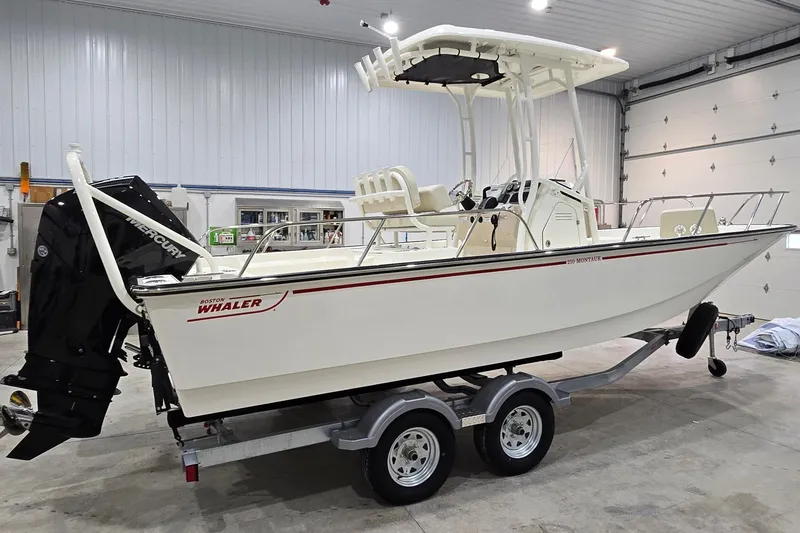 Slide: The Image of 2026 Montauk 210 boat on trailer in indoor storage facility. - 15