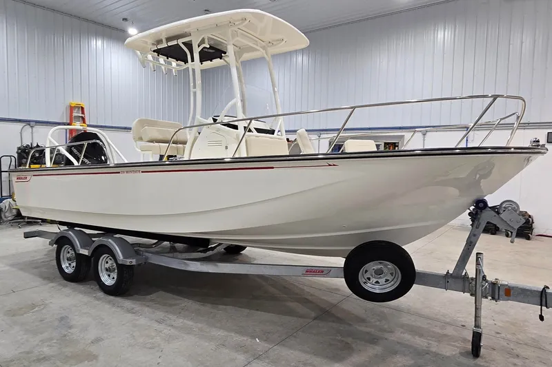 Slide: The Image of 2026 Montauk 210 boat on trailer in indoor storage facility. - 14
