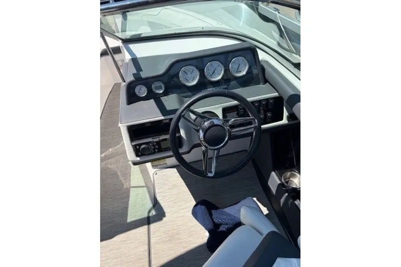Slide: The Image of 2018 Regal 2300 Bowrider dashboard with steering wheel and instrument panel. - 9