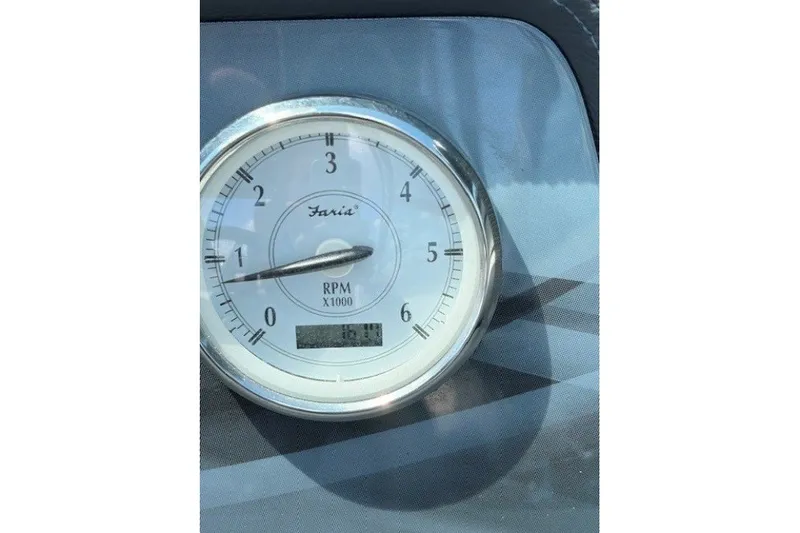 Slide: The Image of Close-up of a Faria RPM gauge on a 2018 Regal 2300 Bowrider boat dashboard. - 8