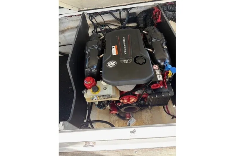 Slide: The Image of Engine compartment of a 2018 Regal 2300 Bowrider boat, featuring a Volvo Penta engine. - 13