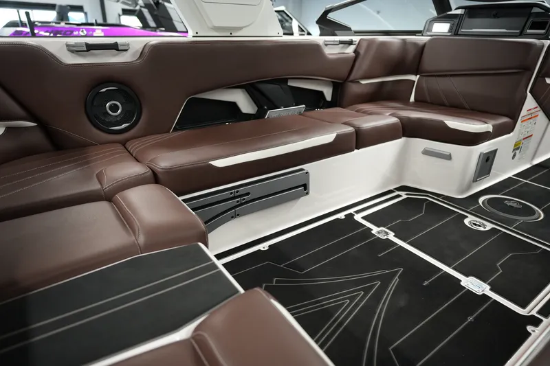 Slide: The Image of 2024 Supra SA 450 boat interior with luxurious brown seating and modern design. - 17