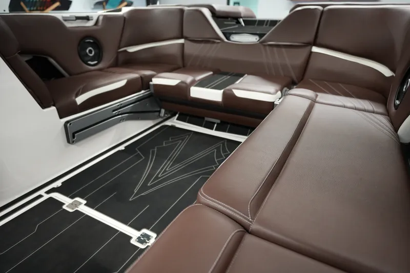 Slide: The Image of Luxurious interior of 2024 Supra SA 450 boat with brown leather seating. - 15