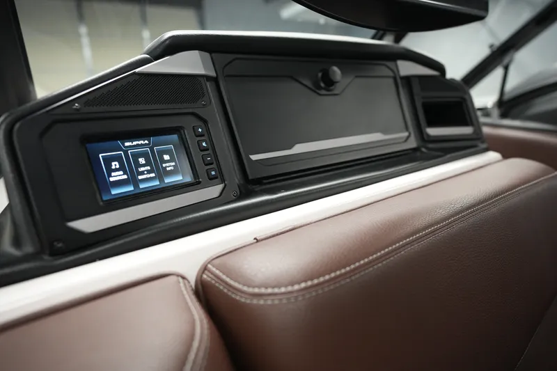 Slide: The Image of 2024 Supra SA 450 dashboard with touchscreen controls and brown leather interior. - 24