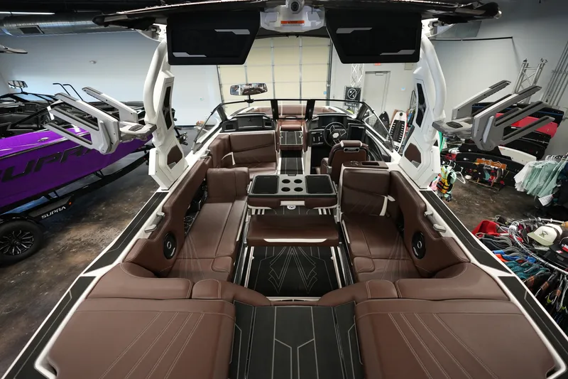 Slide: The Image of 2024 Supra SA 450 boat interior with luxurious brown seating and advanced features. - 14