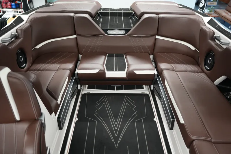 Slide: The Image of Luxurious brown leather interior of 2024 Supra SA 450 boat, featuring spacious seating. - 16