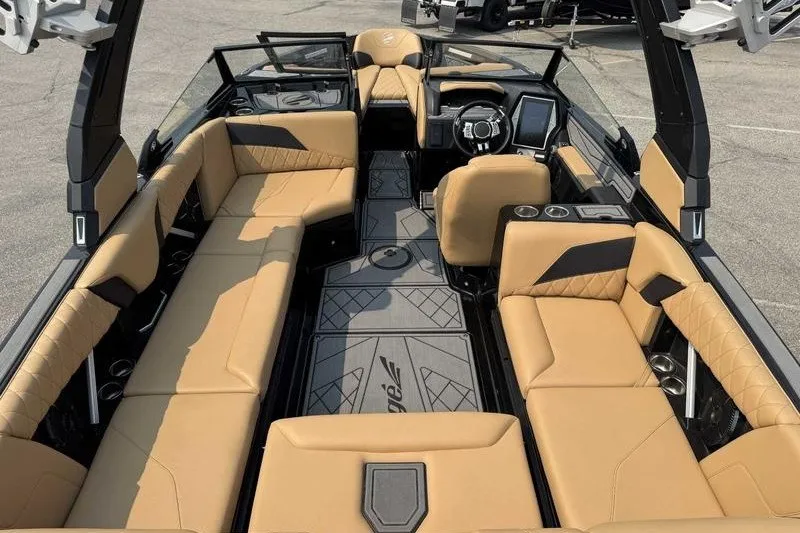 Slide: The Image of 2022 Tigé Z3 boat interior with tan seating and modern dashboard design. - 16