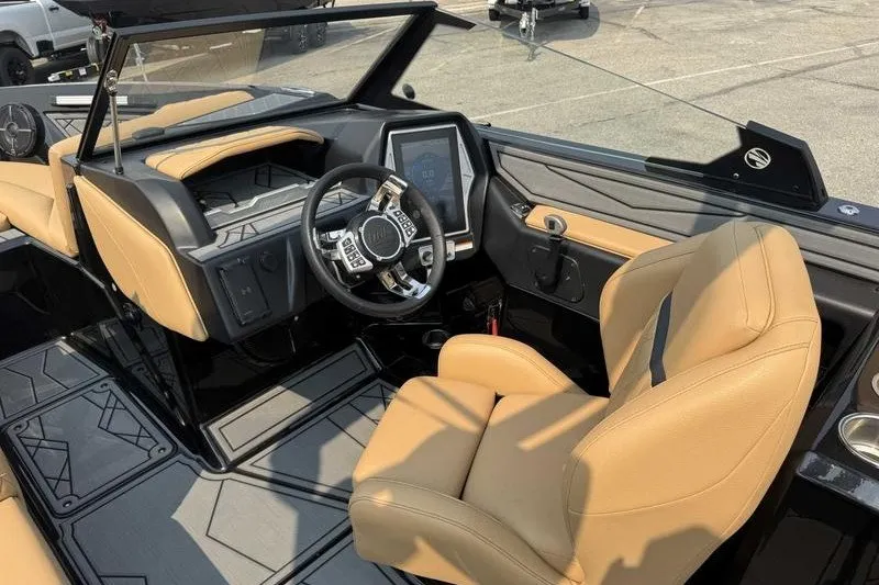 Slide: The Image of 2022 Tigé Z3 boat interior with tan seats and modern dashboard. - 15