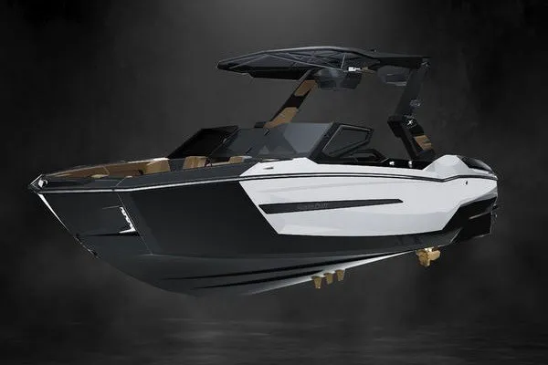 Slide: The Image of 2027 MasterCraft X24 boat with sleek black and white design on a dark background. - 3