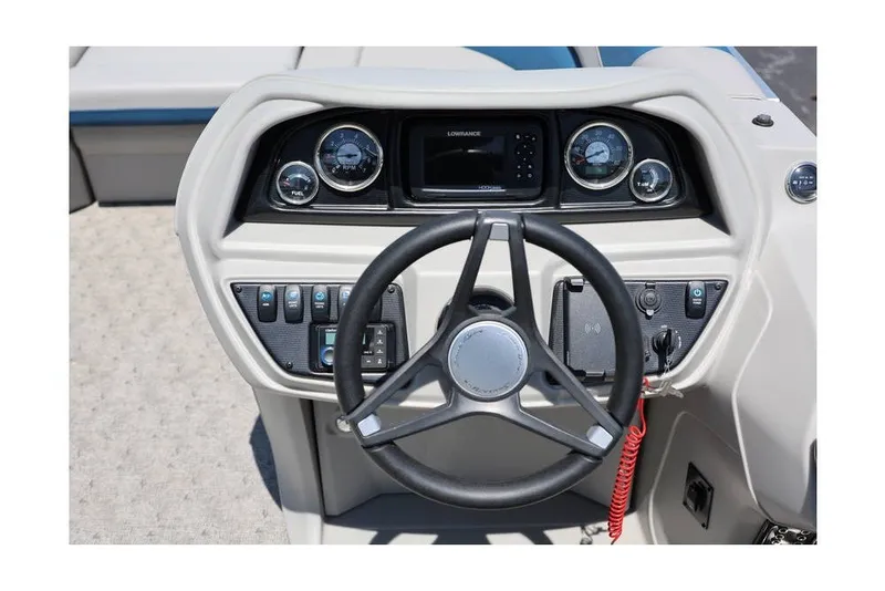 Slide: The Image of Steering console of 2025 South Bay 220 RS LE 2.75 boat with gauges and controls. - 16