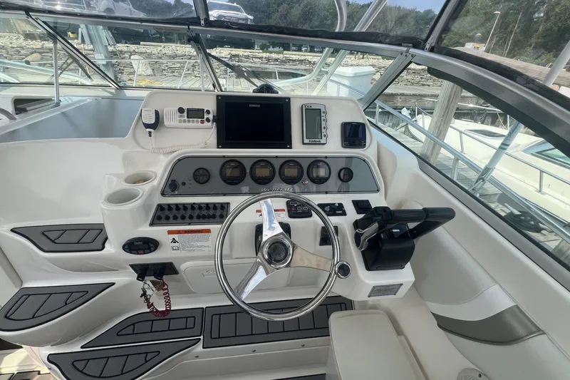 Slide: The Image of Helm of 2005 Wellcraft 290 Coastal boat with steering wheel and navigation instruments. - 5