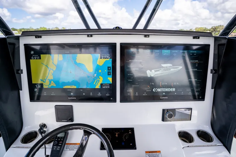 Slide: The Image of Dashboard of 2025 Contender 39 ST boat with dual Garmin displays. - 32