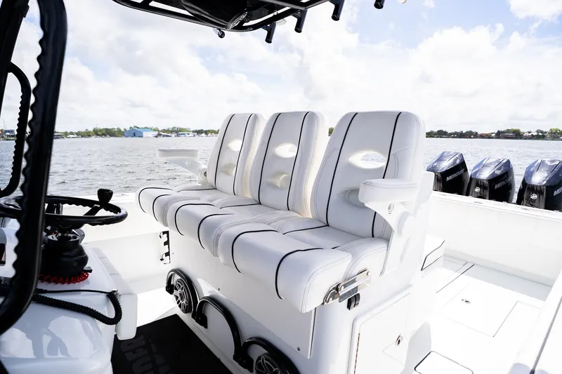 Slide: The Image of 2025 Contender 39 ST boat interior with luxurious seating and multiple outboard engines. - 28