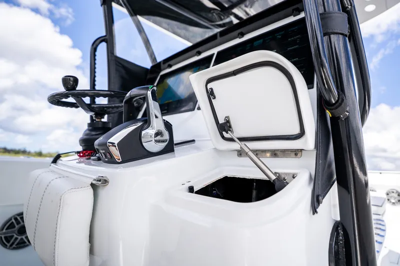 Slide: The Image of 2025 Contender 39 ST boat helm with steering wheel and control panel. - 34