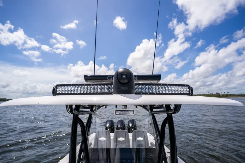Slide: The Image of 2025 Contender 39 ST boat with advanced navigation equipment on open water. - 23