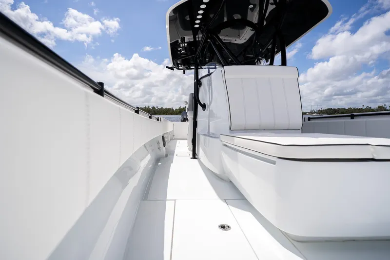 Slide: The Image of 2025 Contender 39 ST boat interior with sleek white seating and modern design. - 26