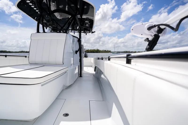 Slide: The Image of 2025 Contender 39 ST boat interior with sleek white seating and modern design. - 25