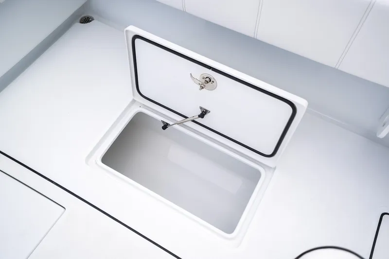 Slide: The Image of Open storage compartment on 2025 Contender 39 ST boat deck. - 45