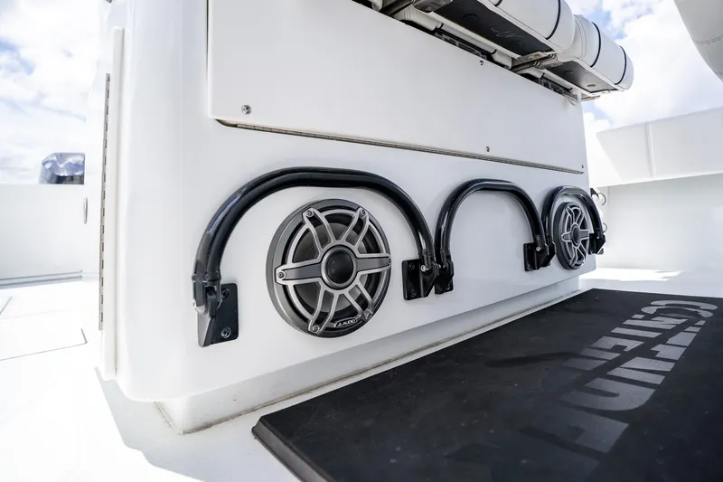 Slide: The Image of 2025 Contender 39 ST boat interior with speakers and storage hooks. - 36