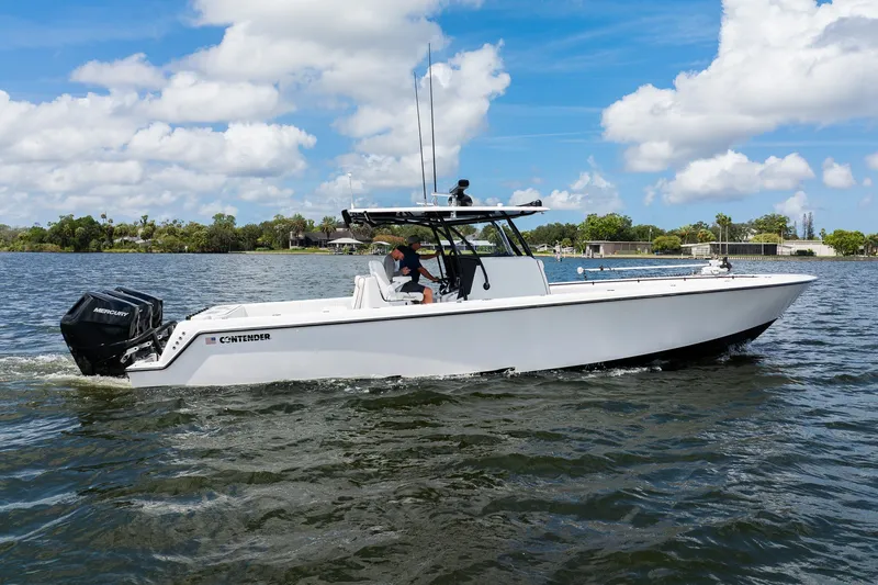 The Image of 2025 Contender 39 ST boat cruising on a sunny day with clear skies. - 1