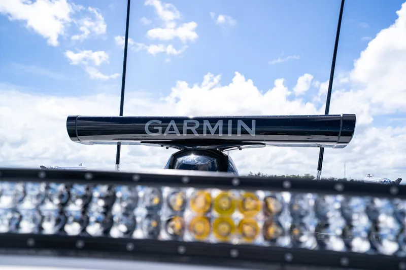 Slide: The Image of Garmin radar on 2025 Contender 39 ST boat under a blue sky. - 24