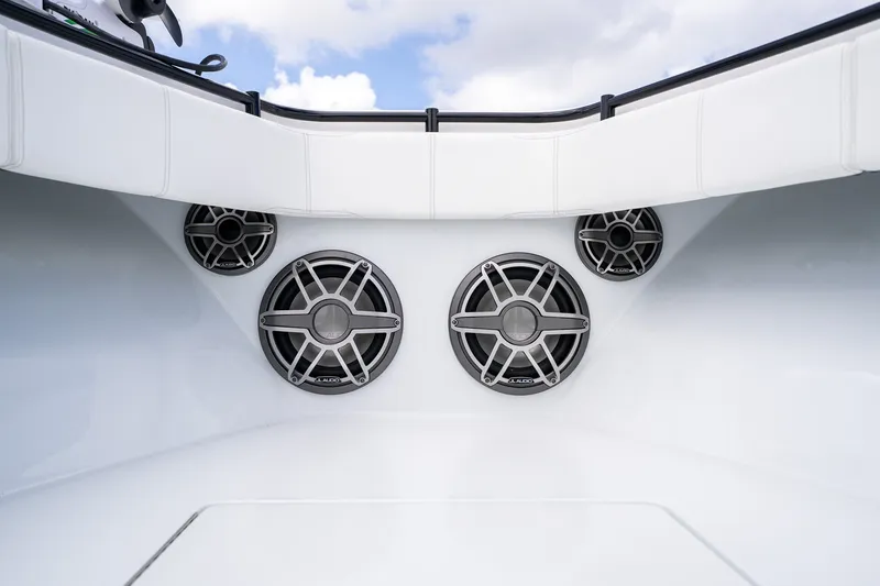 Slide: The Image of 2025 Contender 39 ST boat speakers, sleek design, white interior, clear sky background. - 17