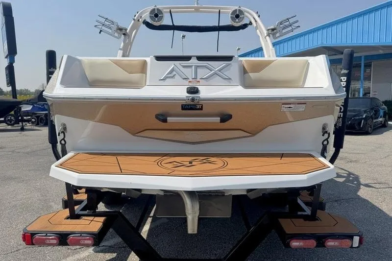 Slide: The Image of 2021 ATX Surf Boats 24 Type-S, rear view, on trailer at dealership. - 15