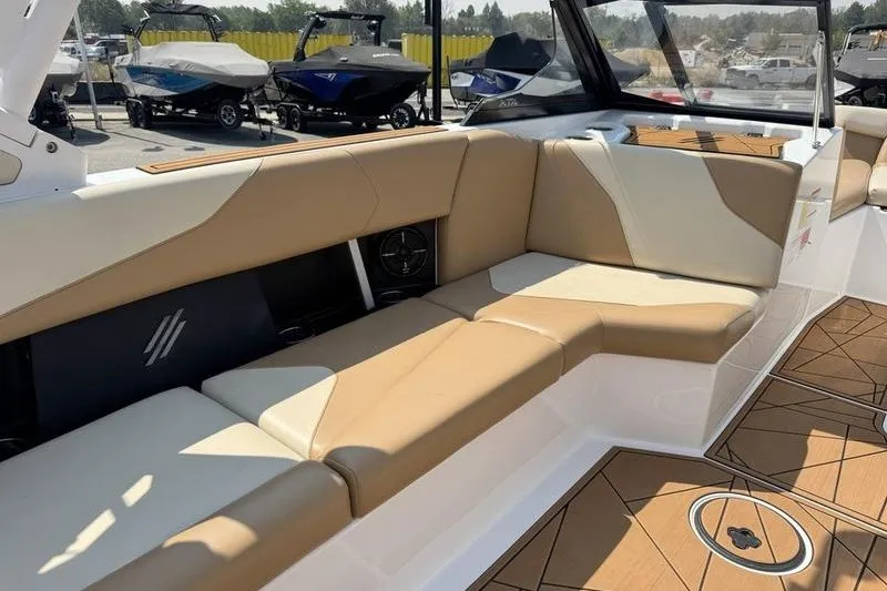 Slide: The Image of Luxurious interior of 2021 ATX Surf Boats 24 Type-S with tan seating and sleek design. - 16