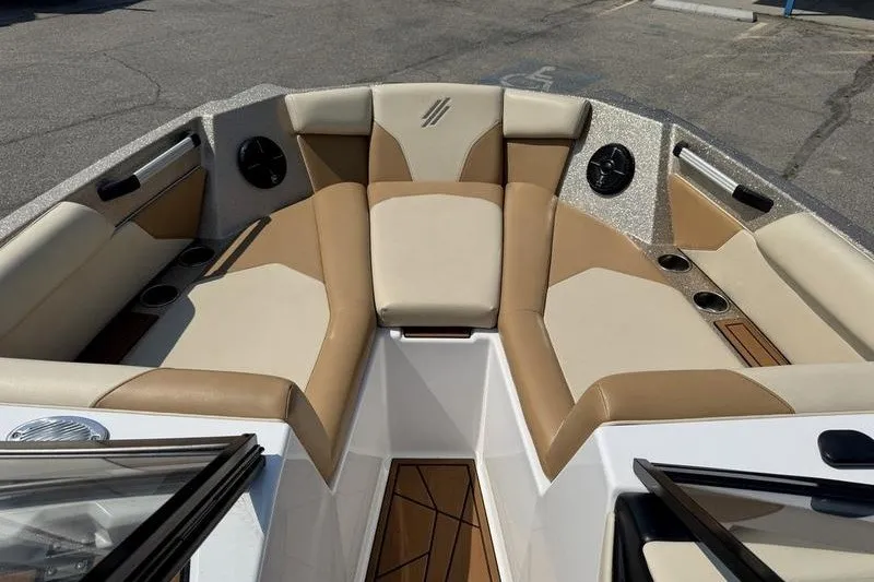 Slide: The Image of 2021 ATX Surf Boats 24 Type-S interior with tan and beige seating. - 18