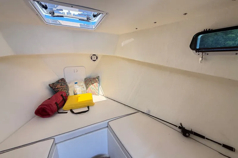 Slide: The Image of Interior cabin of a 2020 Seaway 24 boat with cushions and gear. - 21