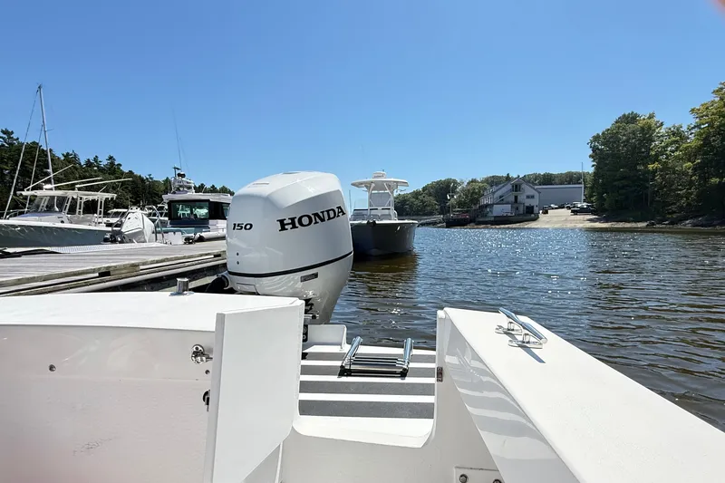 Slide: The Image of 2020 Seaway 24 boat with Honda 150 engine docked at marina. - 36