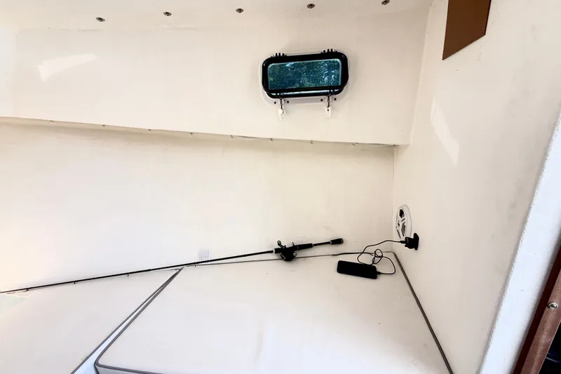 Slide: The Image of Interior cabin of a 2020 Seaway 24 boat with a small window and speaker. - 23