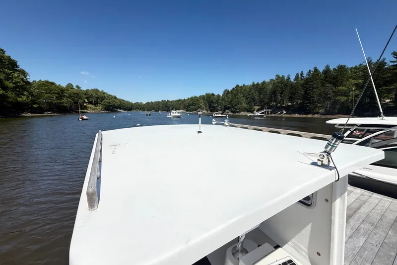 Slide: The Image of 2020 Seaway 24 boat on a serene river with lush green trees. - 33
