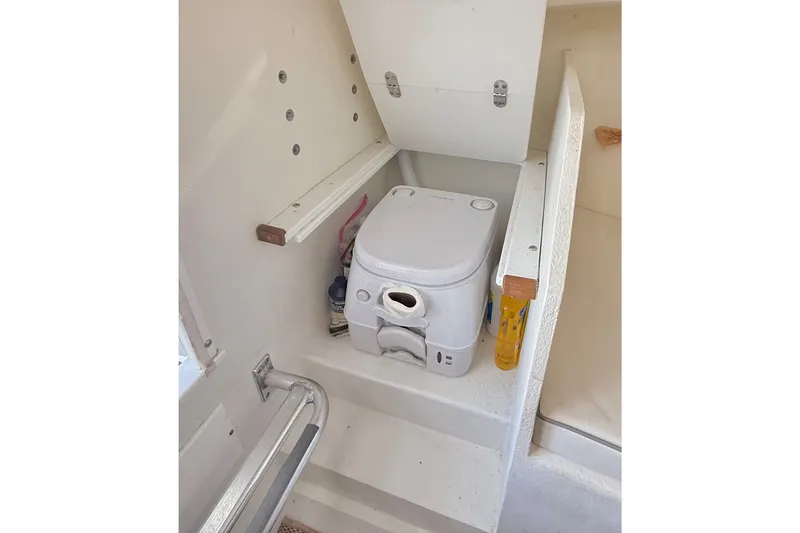 Slide: The Image of Compact marine toilet in 2020 Seaway 24 boat interior. - 25