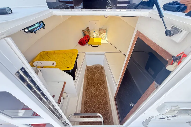 Slide: The Image of Interior cabin of a 2020 Seaway 24 boat, featuring storage and seating areas. - 19