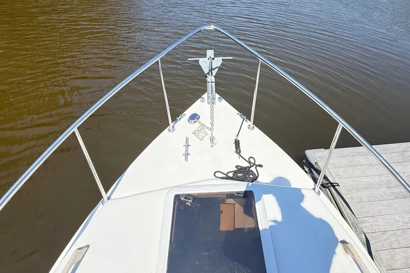 Slide: The Image of Bow view of a 2020 Seaway 24 boat docked on calm water. - 30