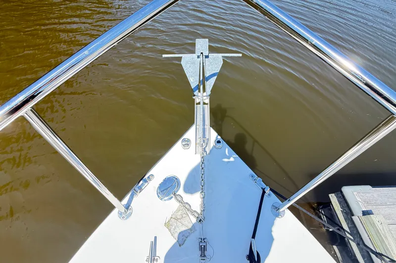 Slide: The Image of Bow of a 2020 Seaway 24 boat with anchor and railing on calm water. - 31
