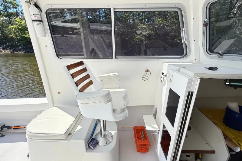 Slide: The Image of Interior of a 2020 Seaway 24 boat with seating and storage compartments. - 18