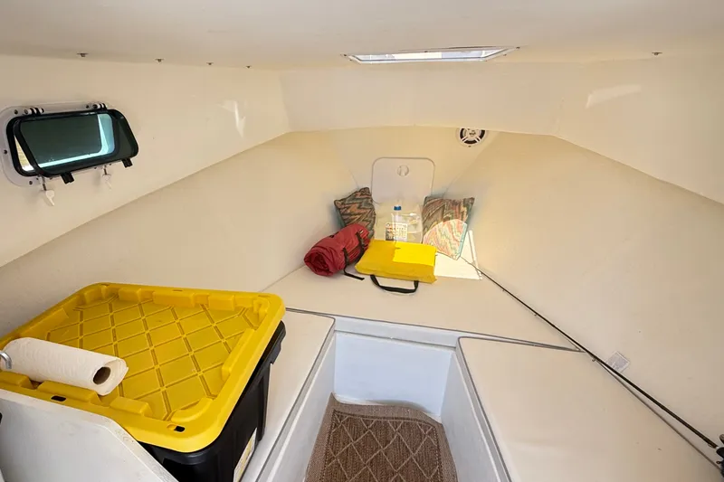 Slide: The Image of Interior cabin of a 2020 Seaway 24 boat with storage and seating. - 20