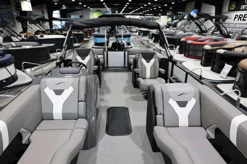 Slide: The Image of 2026 Evotti 523QL luxury pontoon boat interior at a showroom display. - 17