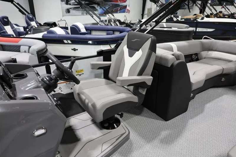 Slide: The Image of Interior of a 2026 Evotti 523QL boat with modern seating and steering console. - 15